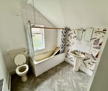 A mid terraced property consists of living room with separate dinin... - Photo 5