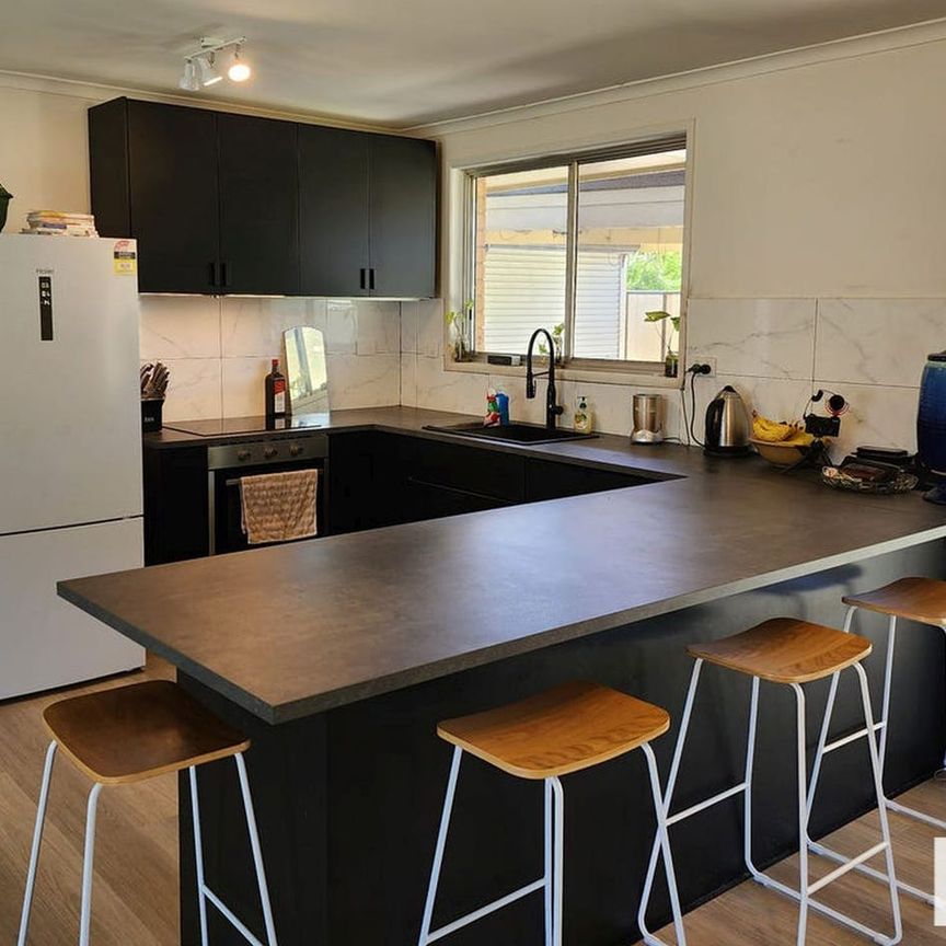 Spacious Corner-Block Family Home with Flexible Living - Photo 1