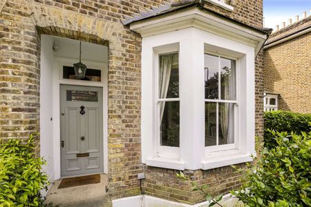 This delightful two-bedroom home offers a perfect blend of comfort and character. - Photo 2