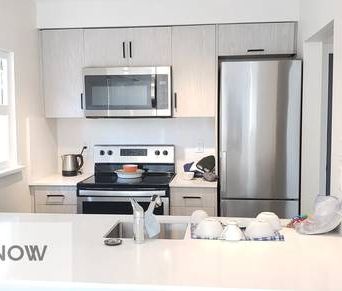 Ground level 1 bedroom unit with in-suite laundry & private patio - Photo 1