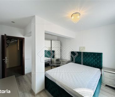 Ap pe 2 niveluri, 75 mp utili + 2 balcoane, mobilat modern - Fotografie 1