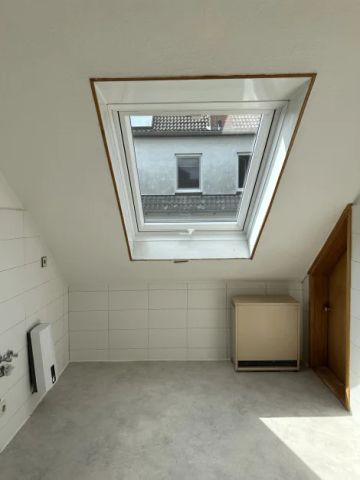 Gepflegte 2-Zimmer-Wohnung mit großer Dachterrasse und Garage - Foto 2