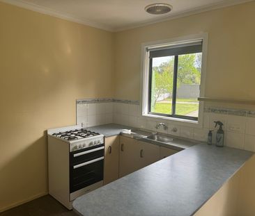 Neat Three-Bedroom Home in Prime Location - Photo 2