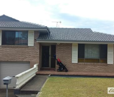 Charming 3 Bedroom Brick Home with Double Garage - Photo 1