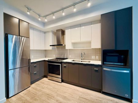 1 Bdrm + Den at Central Green w/ Patio & Greenspace - Photo 2