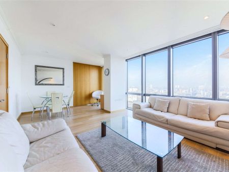 A bright 2 bedroom apartment situated on the 19th floor of this prestigious dockside development located close to the heart of Canary Wharf's business district. - Photo 2