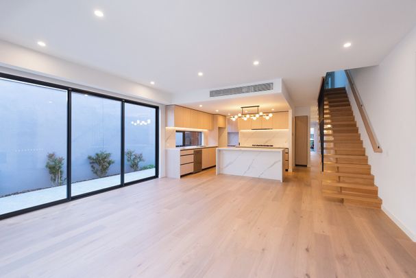 NEAR NEW EXECUTIVE TOWNHOUSE IN A PREMIER LOCATION - Photo 1