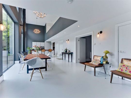 A truly impressive family home in a popular residential road in Esher, offering stylish and modern living with 5 bedrooms, 3 bathrooms and 4 reception areas. - Photo 1