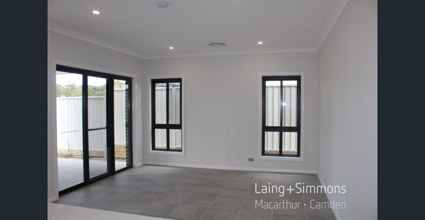 Brand New - 4 Bedroom + Multiple Living Areas + Large Yard - Photo 1