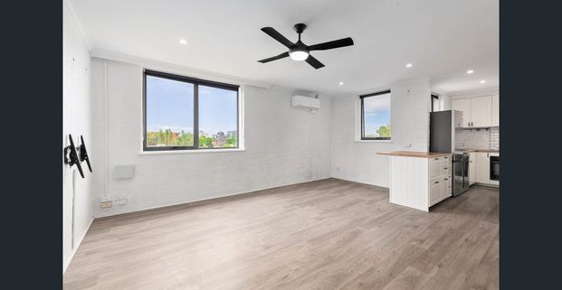 Light-Filled Top-Floor Sanctuary with Sweeping Views and Exceptional Space - Photo 1