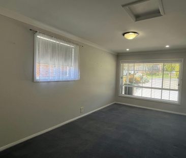 Bright Family Home with Sunroom and Outdoor Living Space - Photo 4