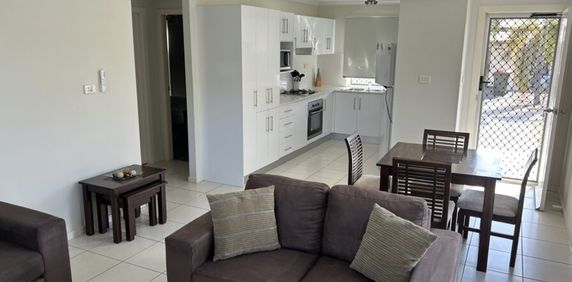 Furnished unit with garage/storage - Photo 2