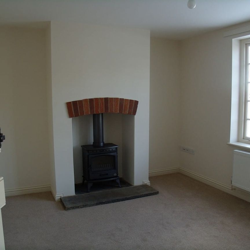 A semi-detached cottage situated a rural village within close proximity to Malton. The cottage was constructed in 2010 and compromises a kitchen, living room, two bedrooms and a bathroom. The property benefits from off road parking and a garden. - Photo 1