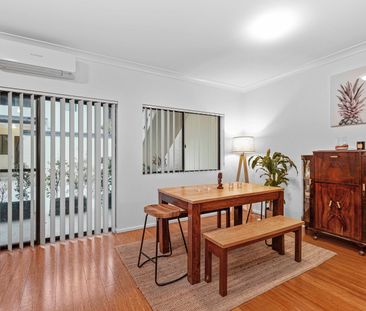 Modern 2 bedroom unit with backyard! - Photo 1