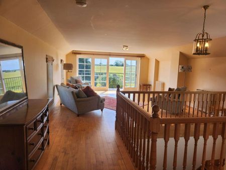 Sympathetically converted in 2005 this contemporary 3 bed detached barn conversion enjoys and enviable location. Sitting in it's own private south facing garden - Photo 2