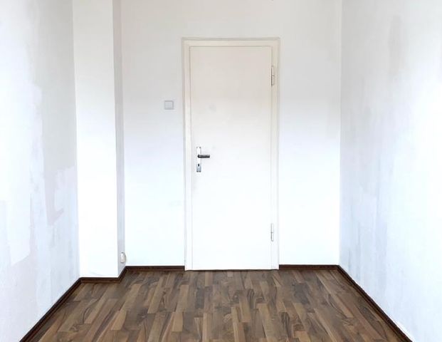 Renovierte helle 3,5-Zimmer-Wohnung mit Balkon und Garten - Foto 1