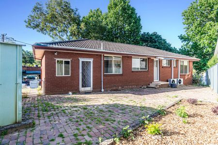 Charming Family Home with Spacious Layout & Low-Maintenance Yard - Photo 2