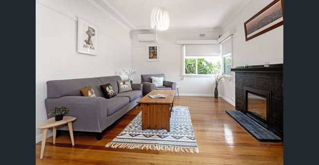 Family home located in the McKinnon School Zone! - Photo 1