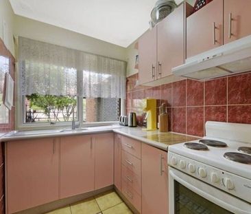 Centrally Located Three-Bedroom Townhouse - Photo 1