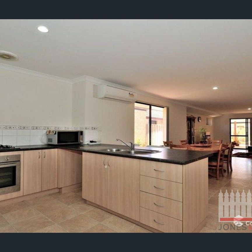 PERFECTLY POSITIONED FOUR BEDROOM HOME - Photo 1