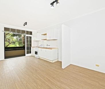 Conveniently Located with a Lock-Up Garage - Photo 5