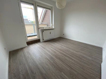 Moderne Dachgeschosswohnung mit großer Dachterrasse im Herzen von Westerstede! - Foto 2