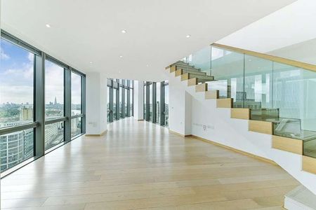 This superb two bedroom duplex apartment on the 27th and 28th floors, enjoys unparalleled views over Canary Wharf and the quayside at West India Quay. - Photo 2