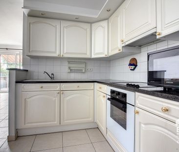 GELIJKVLOERS APPARTEMENT MET 2 SLAAPKAMERS - Photo 4