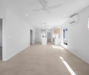 Modern Palmview Living with Media Room & Study Nook - Photo 2