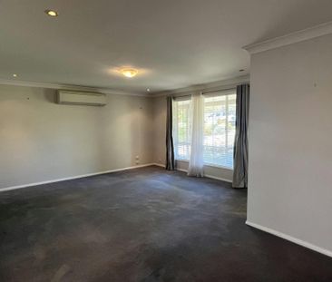 Bright Family Home with Sunroom and Outdoor Living Space - Photo 2