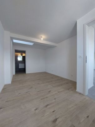 Appartement de 2,5 pièces au 2ème étage avec jardin commun - Photo 1