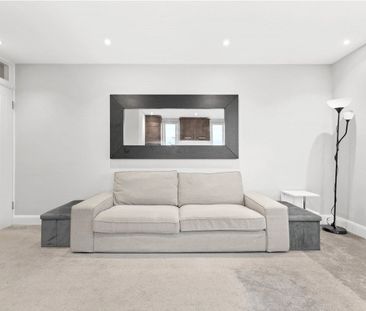 Located within secure gated grounds on a peaceful residential stree... - Photo 1