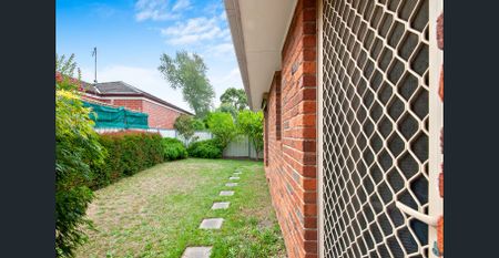 Two-Bedroom Townhouse with Tranquil Garden Setting - Photo 4