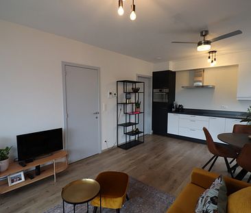 Een nieuwbouw appartement op de 1ste verdieping links achteraan met 2 slaapkamers, terras en overdekte autostaanplaats. - Foto 6