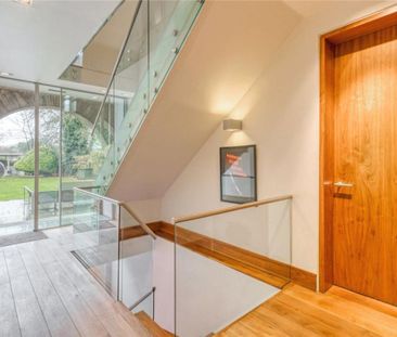Behind gates is a substantial, detached home on one of Hampstead Garden Suburbs most prestigious roads. The house offers spectacular family accommodation and is presented in immaculate condition. - Photo 3