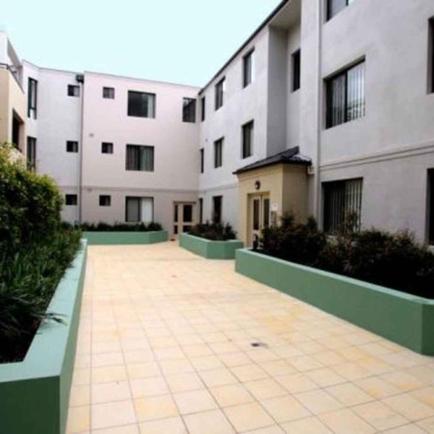 MODERN 2 BEDROOM APARTMENT ON 2ND FLOOR OF SECURITY COMPLEX - Photo 2