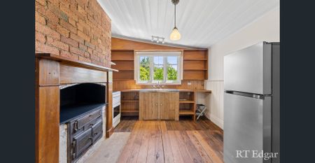 Circa 1892 Cottage with Storybook Gardens – A Truly Special Place to Call Home - Photo 4