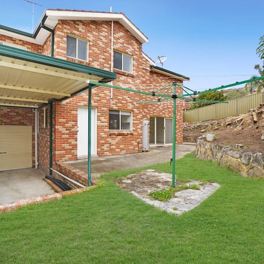 Spacious Four-Bedroom Home with Private Yard & Versatile Living - Photo 1