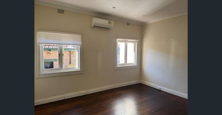 Spacious 4-Bedroom Family Home with Large Backyard Prime Location! - Photo 3