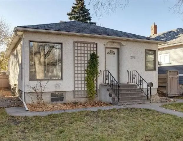 Bright and Airy Renovated Balmoral Bungalo With Large Fenced Yard | 205 19 Avenue Northwest, Calgary - Photo 1