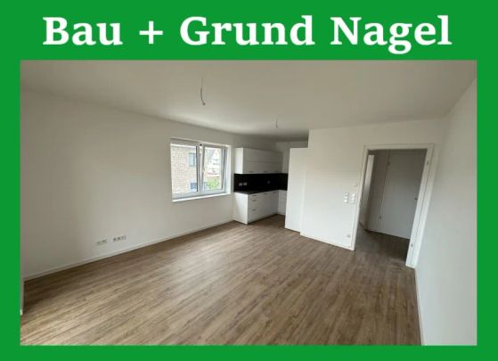 Erstbezug! Neubauwohnung (1.OG) mit Einbauküche, Aufzug, Balkon, Tiefgarage etc. im Zentrum - Foto 1