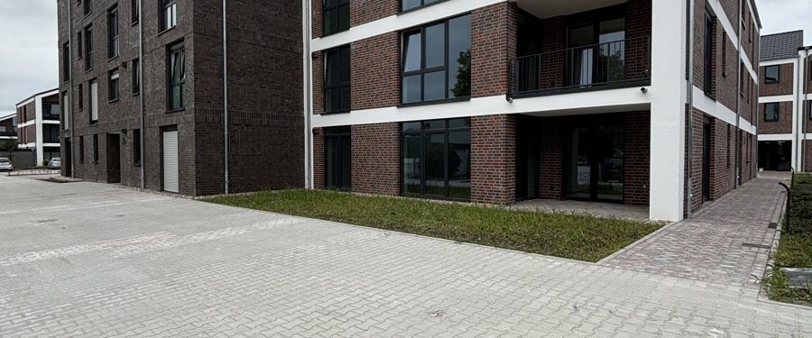 Wohnen am Norder Tief: Schöne Erdgeschosswohnung mit Blick auf die Mühle! ERSTBEZUG - Foto 1