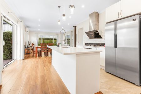 Modern four-bedroom home for rent in the popular Flagstaff area, featuring a master bedroom with a stylish ensuite, a modern kitchen with gas cooking and a pantry for extra storage, two spacious living areas with a cozy fireplace, a contemporary bathroom, and a double internal-access garage. - Photo 5