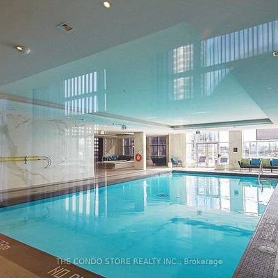 Feels brand new + den parking included indoor pool! - Photo 1