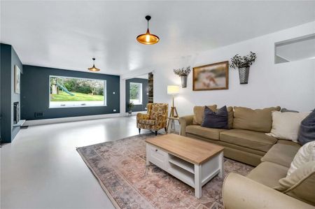 A truly impressive family home in a popular residential road in Esher, offering stylish and modern living with 5 bedrooms, 3 bathrooms and 4 reception areas. - Photo 2