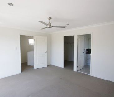 Comfortable Four-Bedroom Home with a Fully Fenced Yard - Photo 4