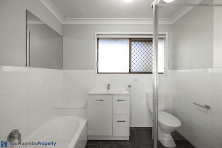This impeccably presented brick townhouse is sure to impress! - Photo 4