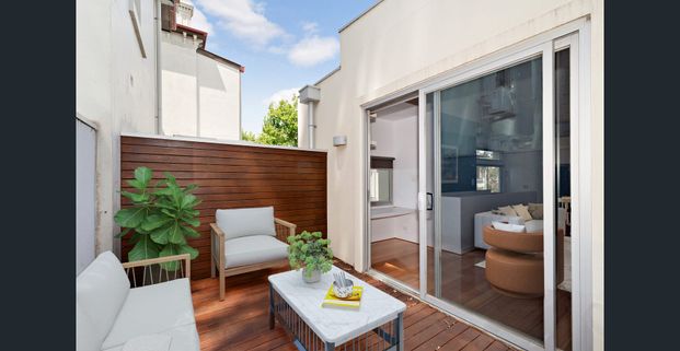 Modern Two-Bedroom Townhouse with Balcony and Secure Garage - Photo 1