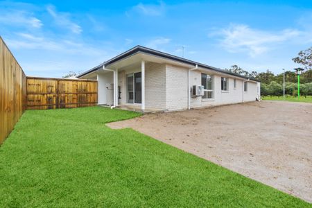 Brand New 3-Bedroom Home in the Heart of Caboolture! Water Included! - Photo 2