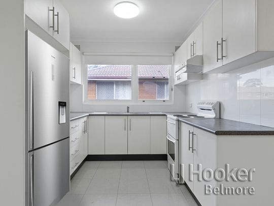 Modern 2 Bedroom Unit with Lockup Garage! - Photo 1